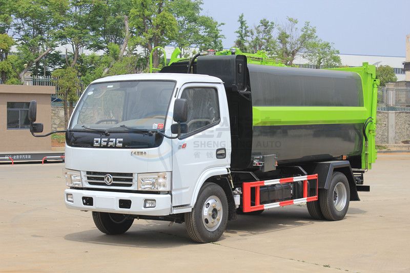 藍(lán)牌7.5方東風(fēng)多利卡壓縮式掛桶垃圾車(chē)